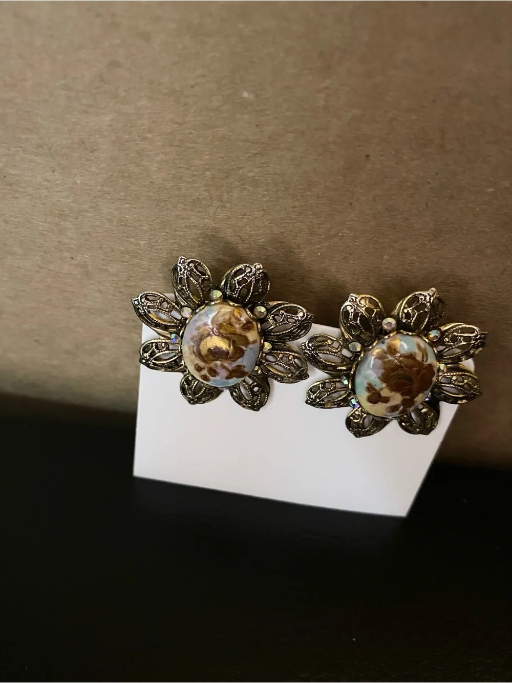 Gold-Tone Floral Filigree Clip Earrings with Brown Resin Center